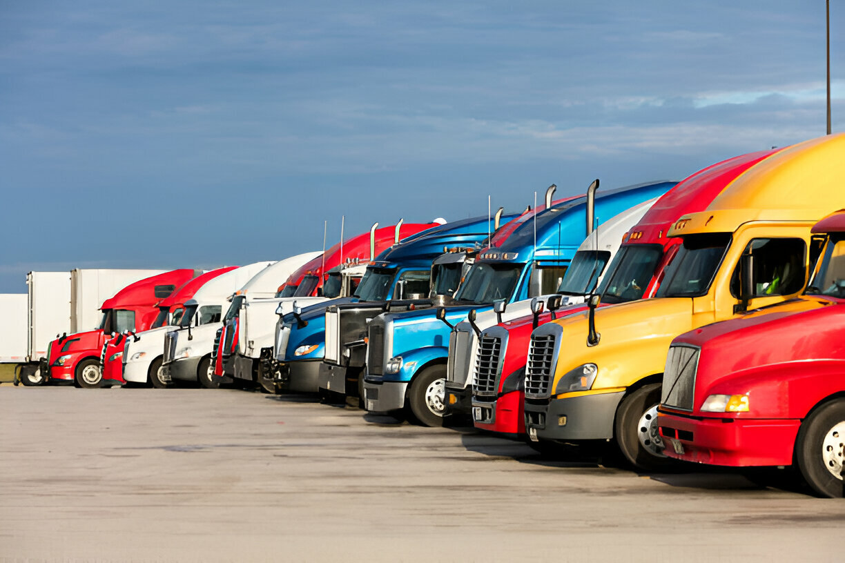 Parked Trucks Under Clouds